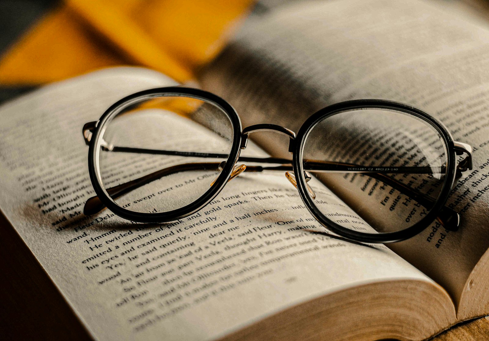 black framed eyeglasses on book page symbolizing understanding your insurance policy